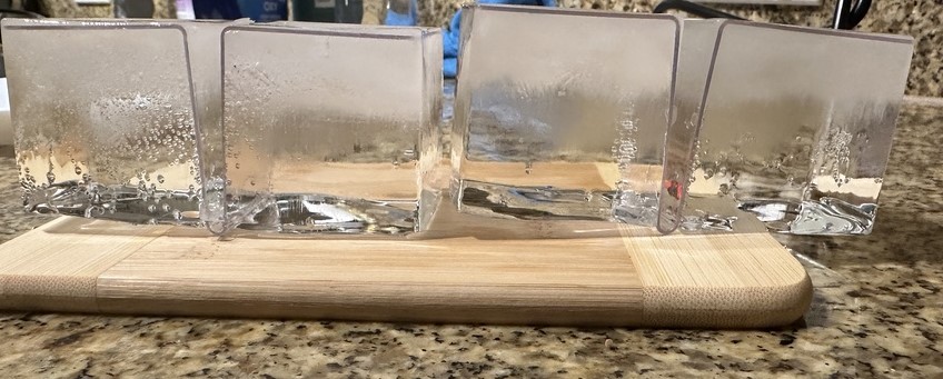 A block of ice on a counter Description automatically generated