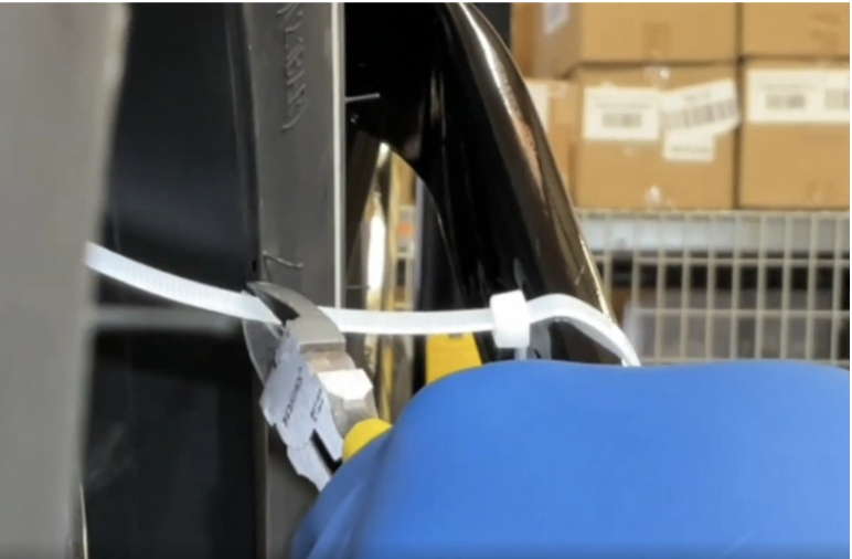 Spinning the wheel against the zip tie to check trueness