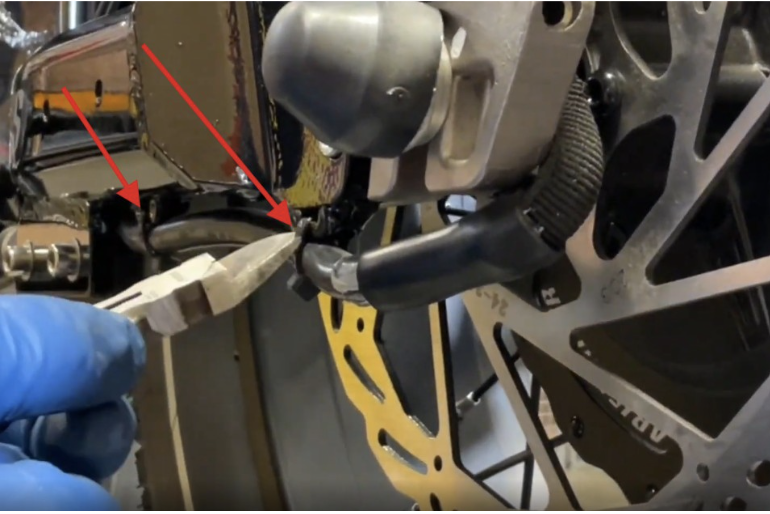Relocating the motor cable away from the rotor bolts