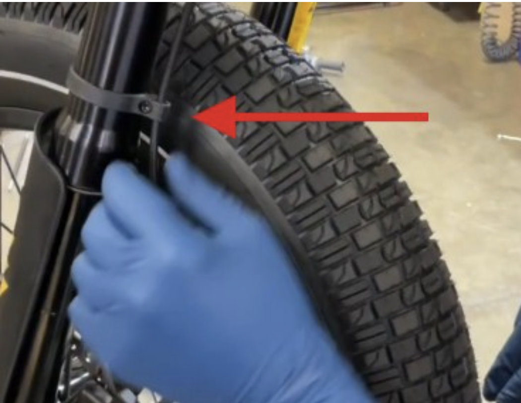 Checking cables and hoses near the fork for pinching
