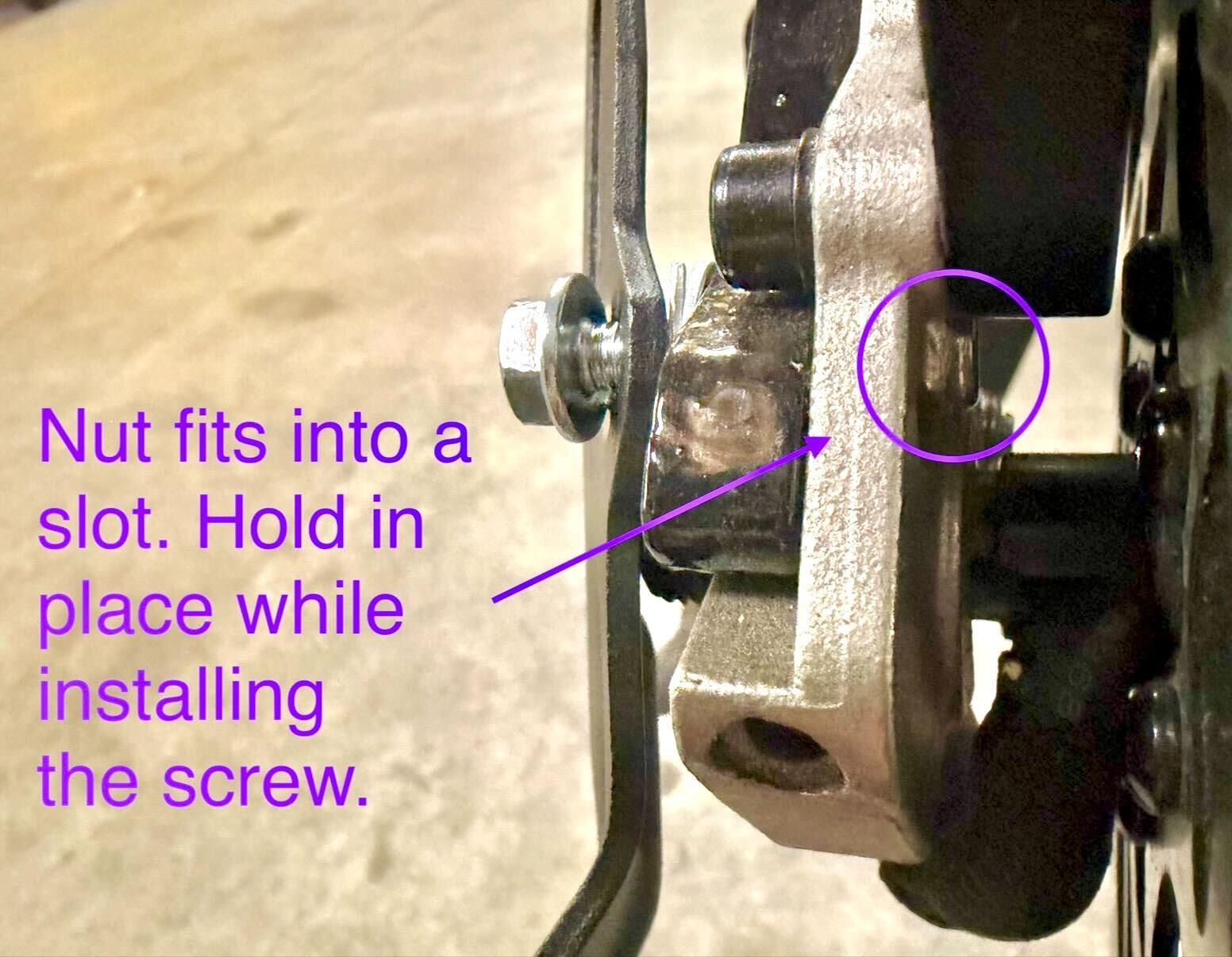 Finger holding nut in dropout slot