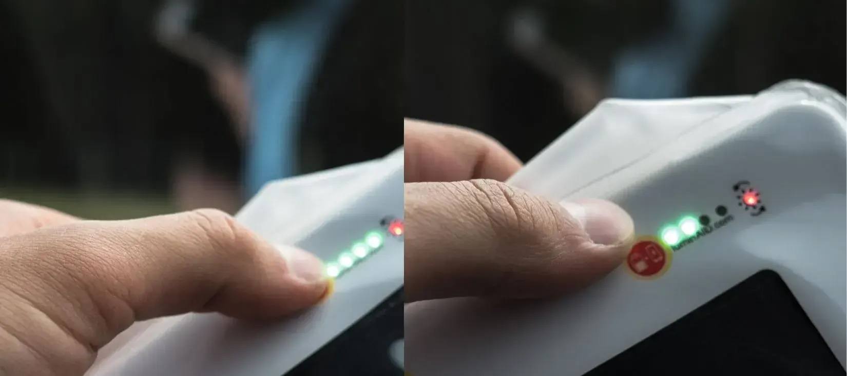 Checking the battery level on our lights - person pressing on the button and exposing 4 green LEDs