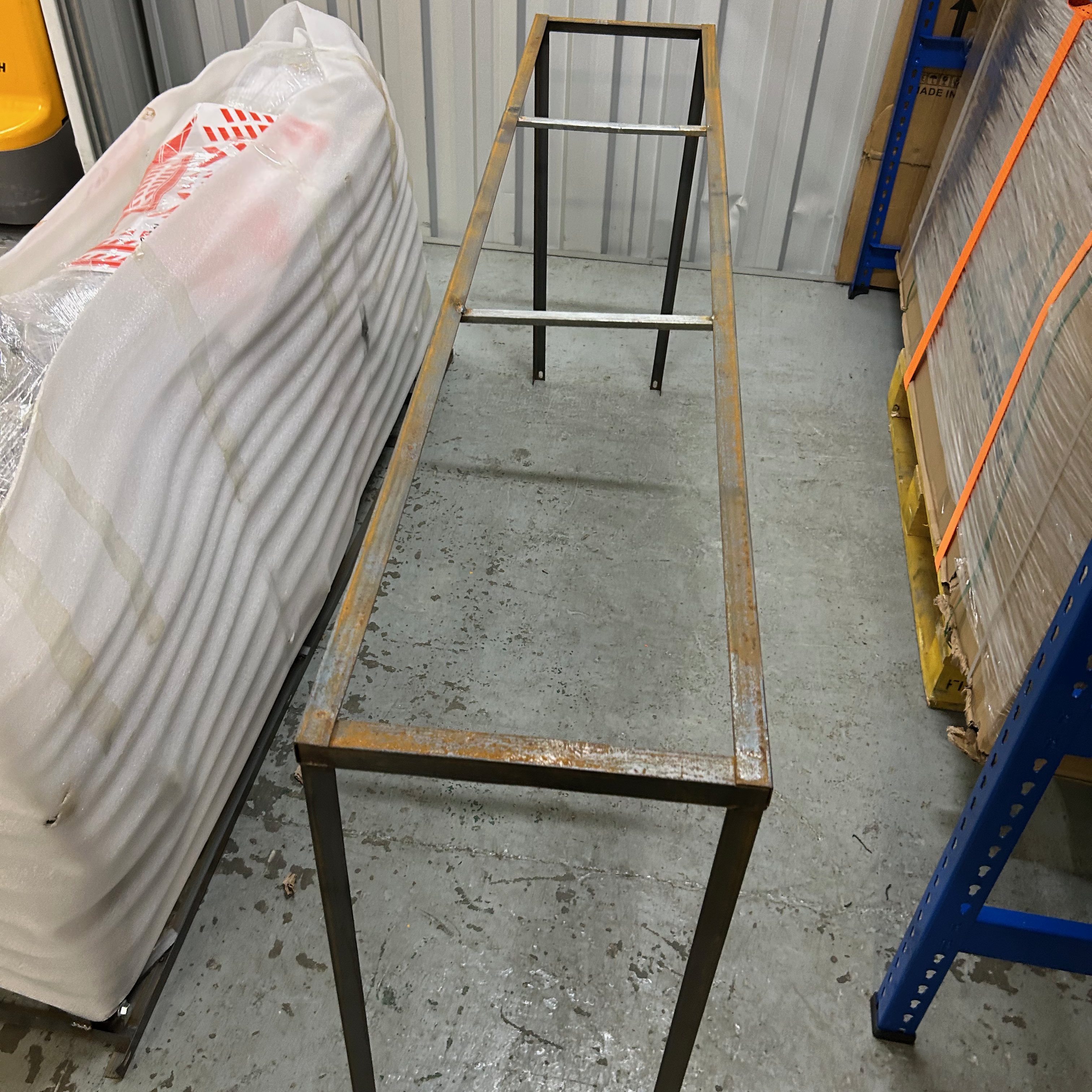 Metal frame on a concrete floor removed from the scooter